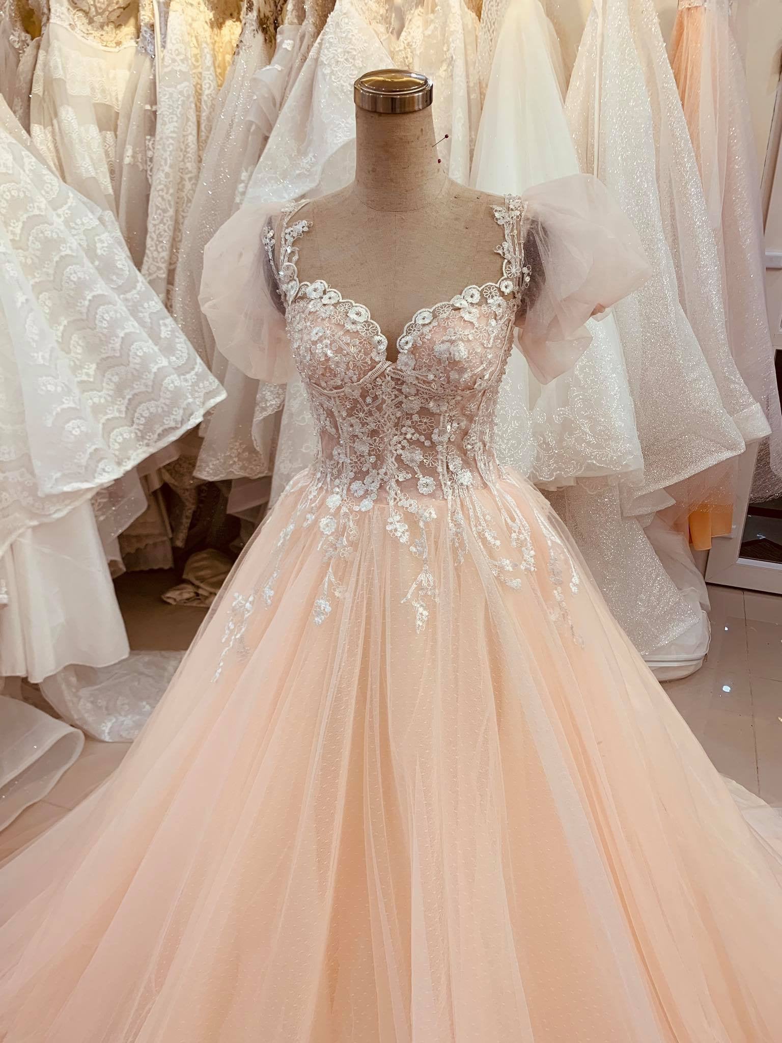 Pastel nude orange lace wedding dress with puffy sleeves and court train